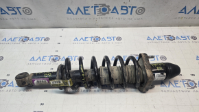 Rusty rear right shock absorber assembly for a Jeep Patriot 11-14.
