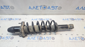 Rusty rear right shock absorber assembly for a Jeep Patriot 11-14.