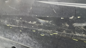 Left underbody protection for VW Jetta 19-26 is worn and dented.