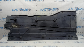 Left underbody protection for VW Jetta 19-26 is worn and dented.