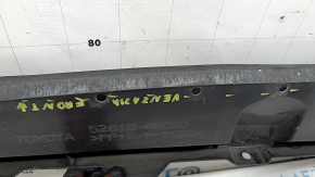 The lower front bumper absorber for a Toyota Venza 21-24 is worn and dented.