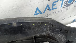 The lower front bumper absorber for a Toyota Venza 21-24 is worn and dented.