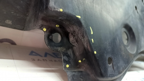 The front bumper guard for a Toyota Venza 21-24 is dented and worn.