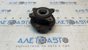 The front left hub of a Mazda CX-30 20-23 is rusty and loose.
