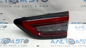 The right inner tailgate light of a Ford Escape MK4 23-26 has a melted housing and connection plug.