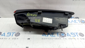 The right inner tailgate light of a Ford Escape MK4 23-26 has a melted housing and connection plug.