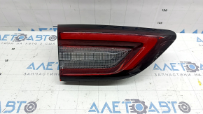 The inner tailgate light on the left Ford Escape MK4 23-26 has a melted housing and connection plug.