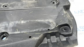 Left underbody protection for Toyota Prius 50 19-22 is dented and torn.