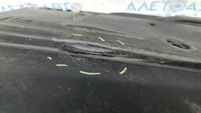 Left underbody protection for Toyota Prius 50 19-22 is dented and torn.