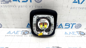 The driver's side airbag in the Jeep Compass 22-26 is black and has a rusty squib.