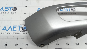 The right front bumper trim of a Volvo XC90 16-19 is cracked and chipped.