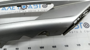 The right front bumper trim of a Volvo XC90 16-19 is cracked and chipped.