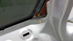 A bare tailgate with glass for a Volvo XC90, 16-22 tinted, silver 711, with a spoiler, brake light, wiper linkage, lighting strip and lock, and a worn spoiler.