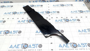 The front right side door trim panel of a Volvo XC90 16-26 is worn out.