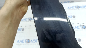The front right side door trim panel of a Volvo XC90 16-26 is worn out.