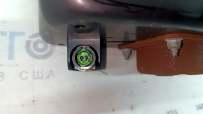 The passenger airbag in the dashboard of a Kia Sportage 23-25 has a rusty squib.