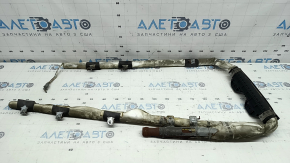 The left side curtain airbag on a Kia Sportage 2023-2026 is covered in soot and has a rusty squib.