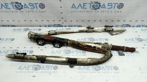 The right side curtain airbag for a Kia Sportage 2023-2026 is covered in soot, the squib is rusty, and it's melted.