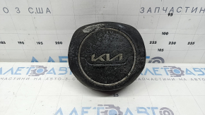 The Kia Sportage 23-25 driver's steering wheel airbag is black, melted, and has a rusty piston.