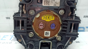 The Kia Sportage 23-25 driver's steering wheel airbag is black, melted, and has a rusty piston.