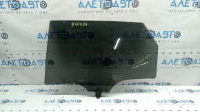 The rear left door glass of a Kia Sportage 23-26 is tinted, the markings are faded.