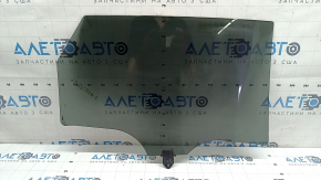 The rear left door glass of a Kia Sportage 23-26 is tinted, the markings are faded.