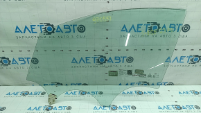 The front left door glass of a Kia Sportage 23-24 has burnt out markings.