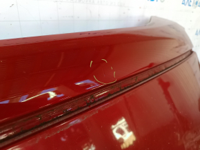 The metal roof of a Toyota Camry V40 is sawn off, with some bumps.