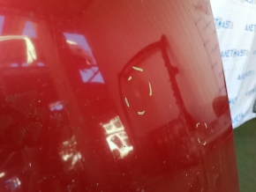 The metal roof of a Toyota Camry V40 is sawn off, with some bumps.