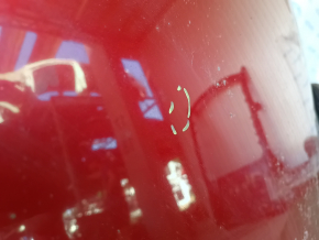 The metal roof of a Toyota Camry V40 is sawn off, with some bumps.