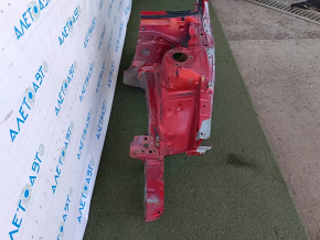 The front left quarter of a Toyota Camry v40 is sawn off, red, rusty, and painted.
