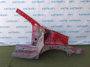 The front left quarter of a Toyota Camry v40 is sawn off, red, rusty, and painted.
