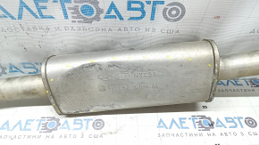 The exhaust pipe, the middle part with the catalytic converter of the Kia Sportage 23-25 2.5, is dented.