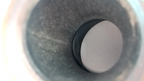 The exhaust pipe, the middle part with the catalytic converter of the Hyundai Santa Fe 24-26 HEV, is dented in the resonator.