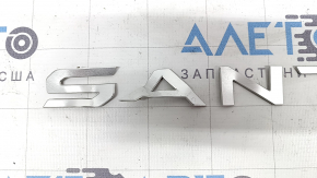 Santa Fe emblem on the Hyundai Santa Fe 24-26 trunk door, gray, bent