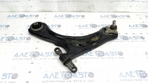 The lower front left control arm of a Kia Sportage 23-26 USA has a torn silent block.