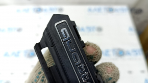 The emblem with the inscription "quattro" on the radiator grille of the Audi A5 F5 20-25 sand