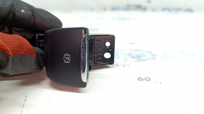 The handbrake button on a Ford Fusion mk5 17-20 has come loose and the chrome is swollen.