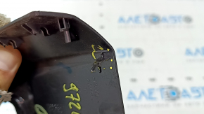 The interior mirror cover for the Audi A5 F5 18-25 is black and has broken fasteners.