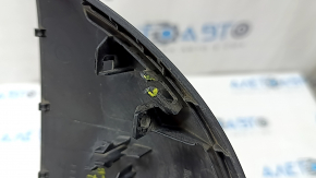 The lower trim of the left side mirror of the Audi A5 F5 18-25 5D has broken fasteners and scratches.