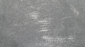 The trunk floor of the Audi A5 F5 19-25 5D is black and dented.