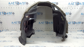 The front left fender liner of a Ford Fusion mk5 17-20 is torn and worn.