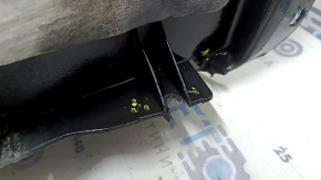 The front left fender liner of a Ford Fusion mk5 17-20 is torn and worn.