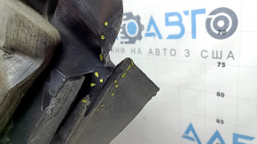 The front left fender liner of a Ford Fusion mk5 17-20 is torn and worn.