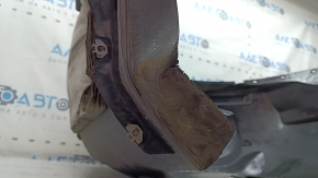 The front left fender liner of a Ford Fusion mk5 17-20 is torn and worn.