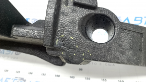 The front bumper absorber of the Subaru Forester 25-26 is dented.