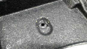The left trunk foam of a Subaru Forester 25-26 is dented.