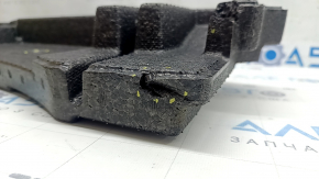 The left trunk foam of a Subaru Forester 25-26 is dented.