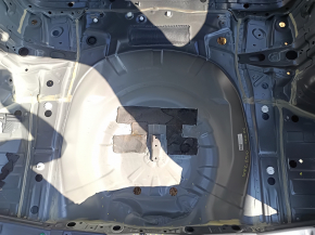 The trunk trough of a Subaru Forester 25-26 on the body is dented