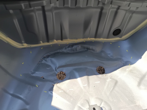 The trunk trough of a Subaru Forester 25-26 on the body is dented